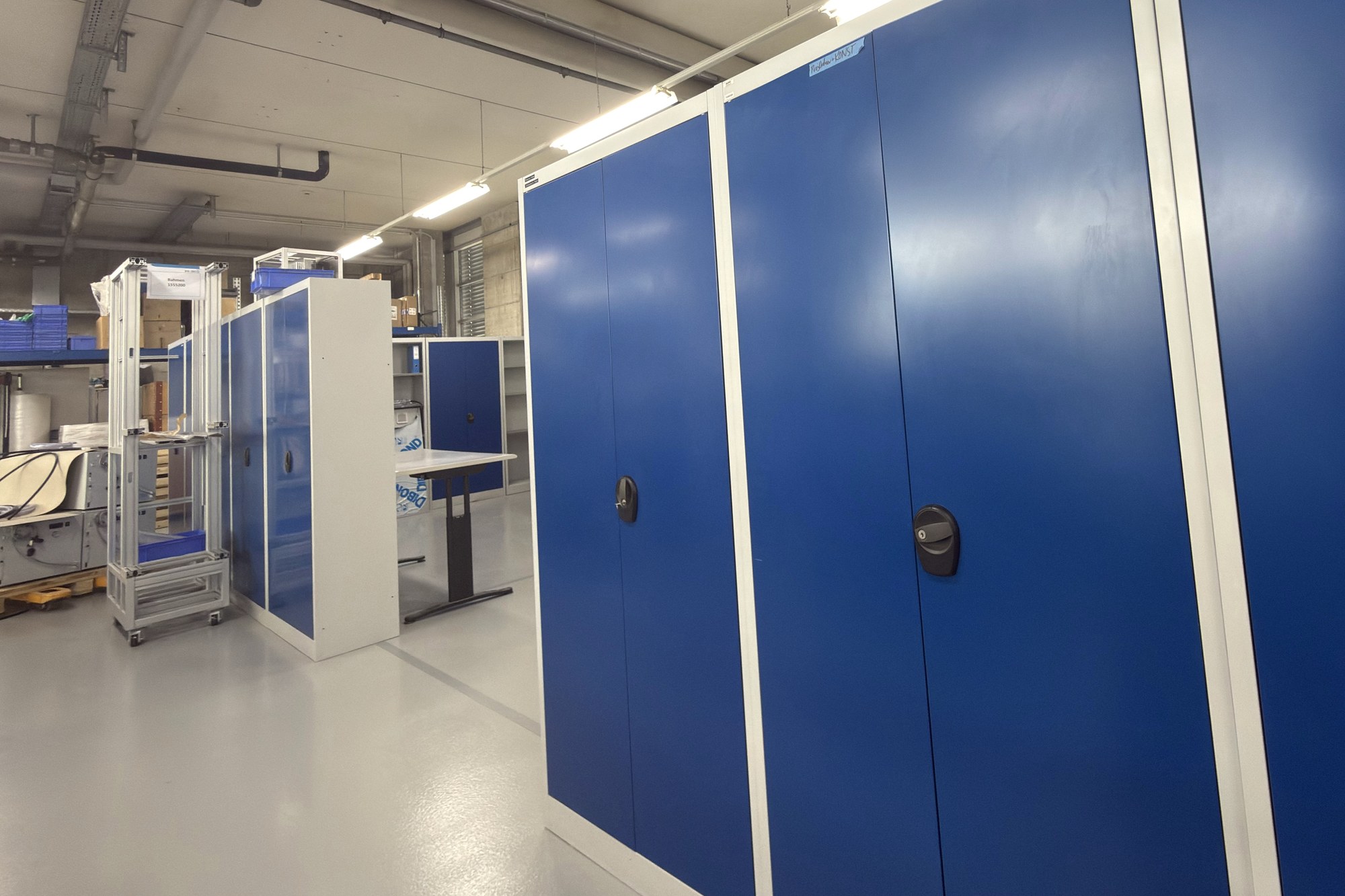 Photo of large blue steel cabinets in the finished workshop.