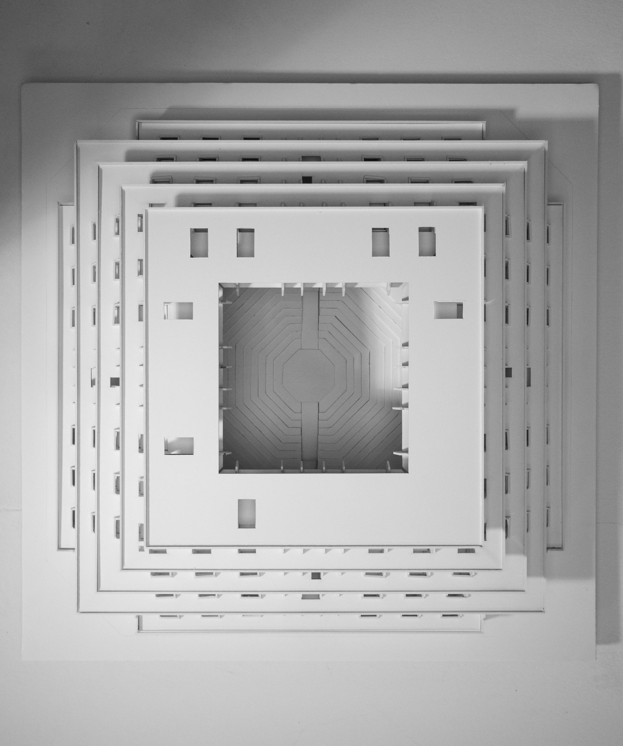 Top view of the model: nested square terraces around the central theatre with its concentric steps.