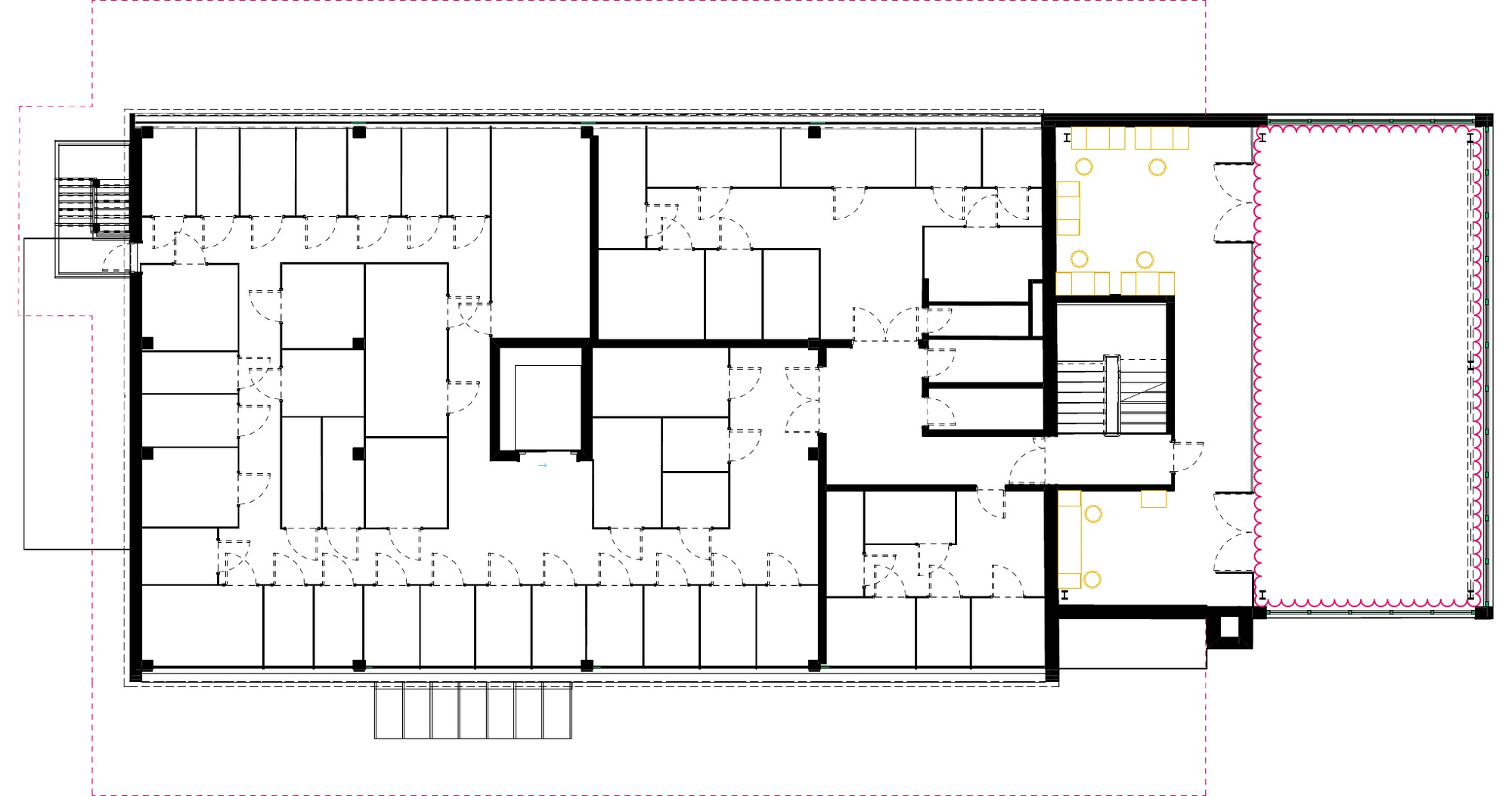 Plan of the second floor: storage cells and corridors, a stair core and a double-height workshop void on the right.
